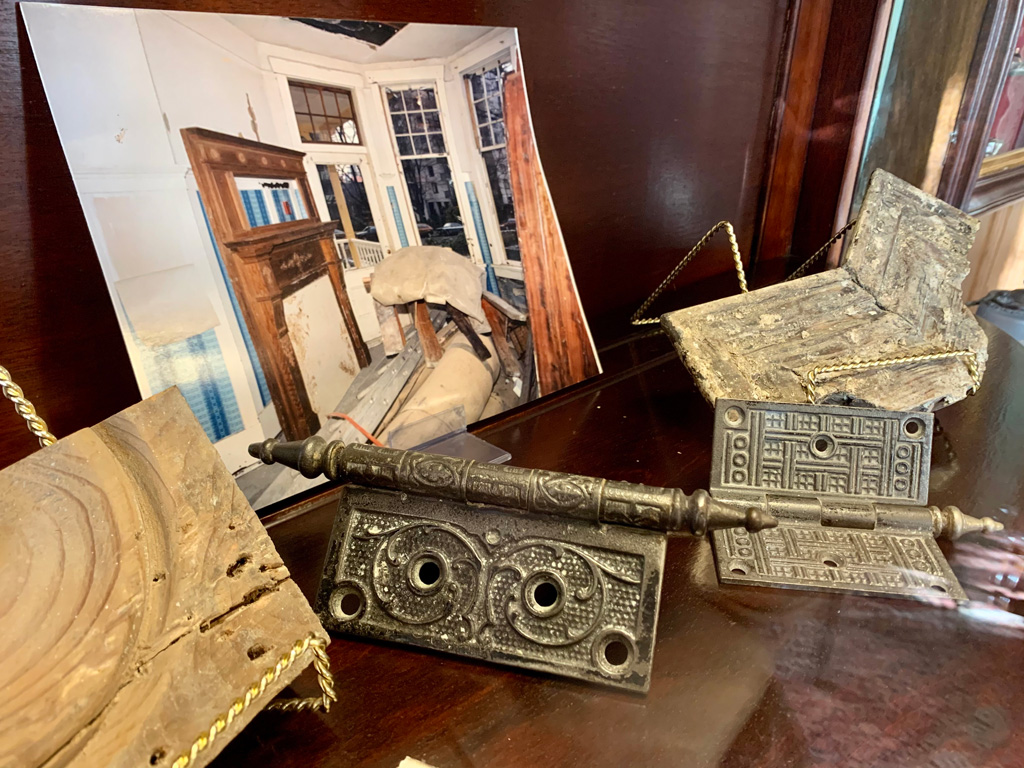 Antique door hinges and photo of Roedde House restoration